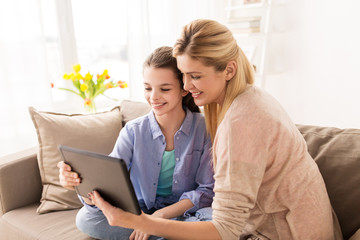 Poster - happy family with tablet pc at home