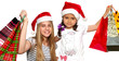 © Petrik - Two little girls in fur-cap with shopping bags. Christmas