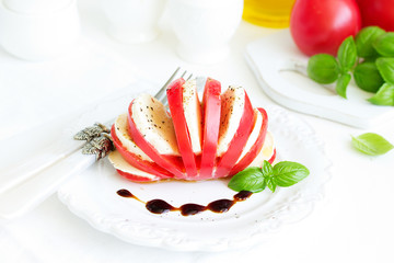 Wall Mural - Italian caprese salad with tomatoes and mozzarella.