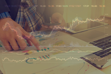 Double exposure business man using technology stock financial indices on currency exchange