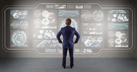 Poster - Businessman using graph screens interface on a wall 3D rendering