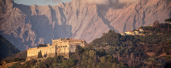 Canvas Print - Massa. View of Malaspina Castle. In the background the Apuan Alps. Massa - Tuscany - Italy.