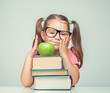 © Myst - bored beautiful cute little girl with green apple and thick books