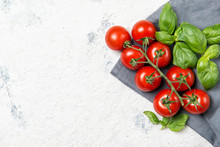 Fresh Cherry Tomatoes With Basil Leaves, Top View With Copy Space
