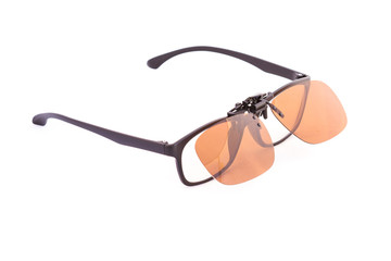 Isolated Eyeglasses with clip on sunglasses on white background