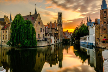 Wall Mural - Bruges (Brugge) cityscape with water canal at sunset