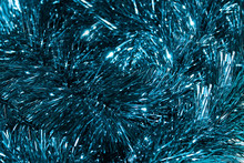Christmas Background. Blue Tinsel Christmas Decoration Seamless Background. Shallow Depth Of Field