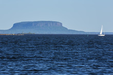 Lake Superior At Thunder Bay With A Butte In The Background.