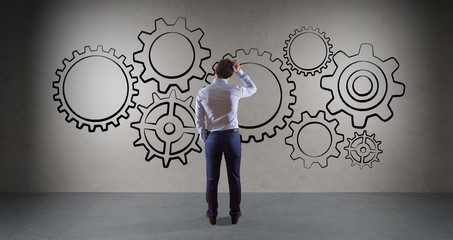 Poster - Businessman watching gears sketch on a wall 3D rendering