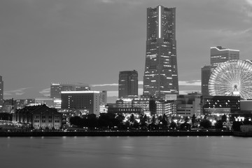  Urban Landscape of Yokohama, Japan with moving colorful clouds in monochrome