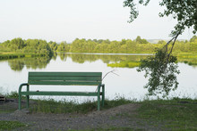 A Quiet Place With A Bench At The River