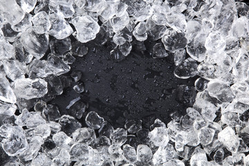 Frame of Crushed ice on black background. Copy space, top view