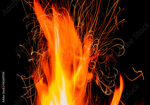 Fotomural Fire and Sparks on a Black Background