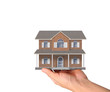© denphumi - Mortgage concept by house from in hand