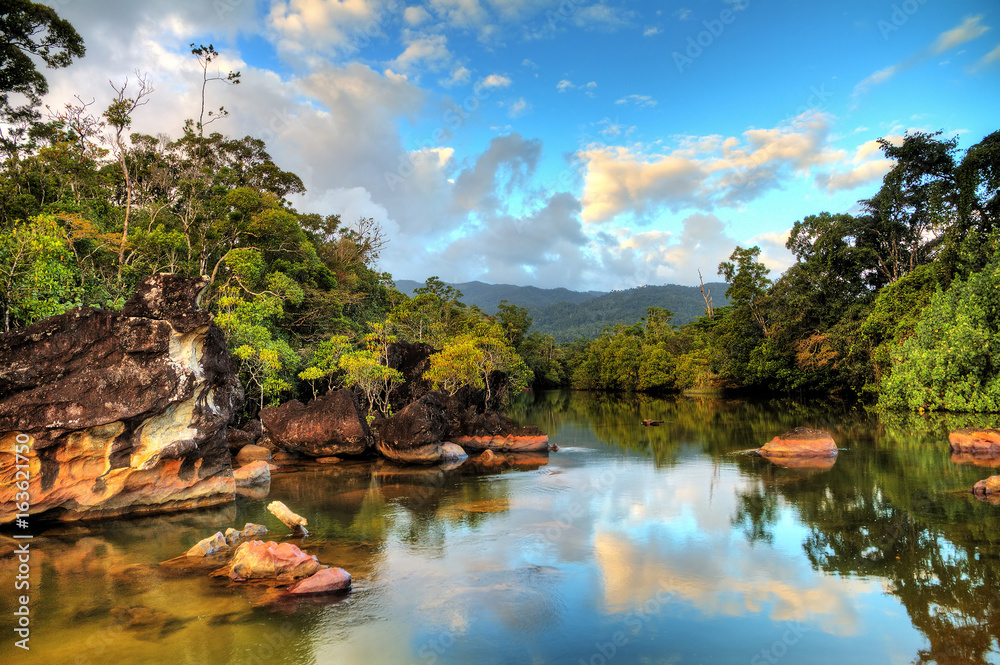 Beautiful view of the tropical jungle river at the beach of Masoala National Park in Madagascar - obrazy, fototapety, plakaty 