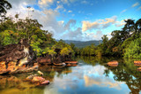 Fototapeta Zachód słońca - Beautiful view of the tropical jungle river at the beach of Masoala National Park in Madagascar
