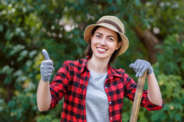 woman gardener holding shovel