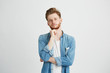 © Cookie Studio - Portrait of dreamy young handsome guy thinking dreaming with hand on chin over white background.