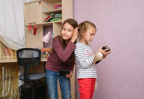 Teens Playing Tablet And Listening To Music With Headphones Naughty And Funny Fight Teens Playing Tablet And Listening To Music With Headphones Naughty And Funny Fight