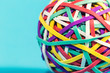 Elastic rubber band ball on a blue background