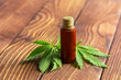 © fotofabrika - Cannabis leaves and oil on wooden background