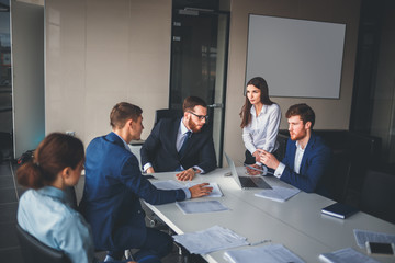 Wall Mural - Business people working in conference room