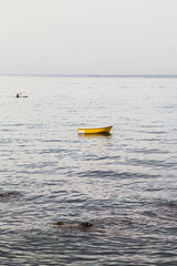 Canvas Print - yellow boat near waterfront in Giardini Naxos