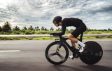 Asian men are cycling "time trial bike" in the morning