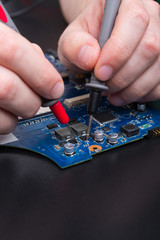 Poster - Laptop motherboard testing in service center