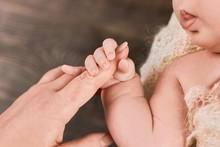 Infant Holding Female Finger. Arm Of A Baby. Grasp Reflex Definition.