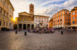 Basilica di Santa Maria in Trastevere and Piazza di Santa Maria in Trastevere at sunset, Rome, Italy. Trastevere is rione of Rome, on west bank of Tiber in Rome. Architecture and landmark of Rome.