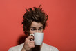 © Volodymyr - morning refreshment of surprised man with cup of tea, coffee