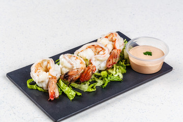 Wall Mural - cooked shrimps on black slate