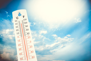 Tropical temperature, measured on an outdoor thermometer, global heat wave, environment concept.