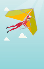 Canvas Print - Young caucasian woman flying on hang-glider.