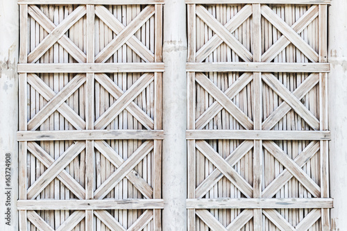 Fotomural White bamboo wicker shutters of window. Bali style exteriour