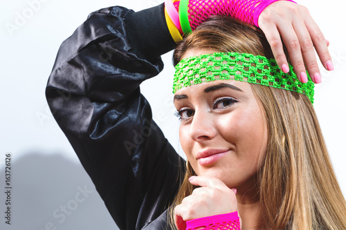 Woman in 1980's fashion on a white background