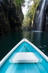 Canvas Print - Small boat travel in Takachiho gorge