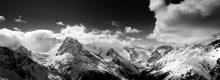 Black And White Panorama Of Snow Mountain At Winter Day