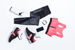 © LIGHTFIELD STUDIOS - top view of sportswear, sportive water bottle for training and digital devices isolated on white