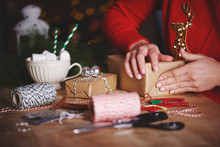 Woman Wrapping Christmas Gift