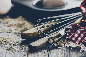 Baking concept kitchen cooking cutlery accessories for baking on wooden background with flour. Closeup. Cooking Process.