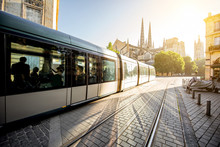 Morning Street View With Tram And Saint Pierre Cathedral In Bordeaux City, France