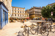 View on the small square with bicycles in Bordeaux city in France