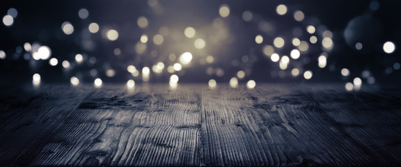 Wall Mural - Gold and silver bokeh on a dark background