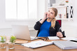© Prostock-studio - Pregnant business lady at work talking on phone