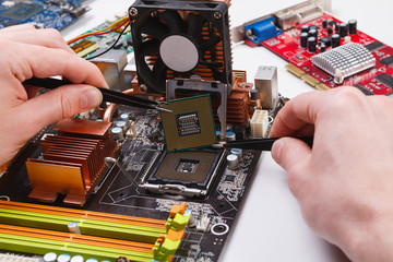 Poster - Technician plug in microprocessor to motherboard