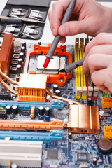 Aufkleber - Engineer checking motherboard with multimeter