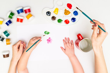 Wall Mural - Child painting a flower