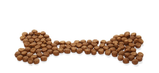 Wall Mural - Dry dog food in bone shape isolated on white background